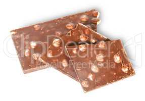 Pieces of dark chocolate with hazelnuts