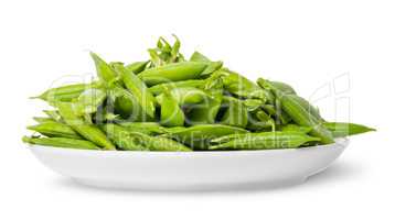 Pile of green peas in pods on white plate