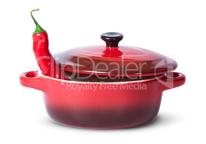 Red chili pepper in saucepan with lid