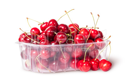 Red sweet cherries in plastic tray rotated and three near