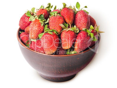 Ripe juicy strawberries in a ceramic bowl top view