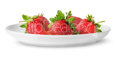 Several pieces of strawberry on white plate