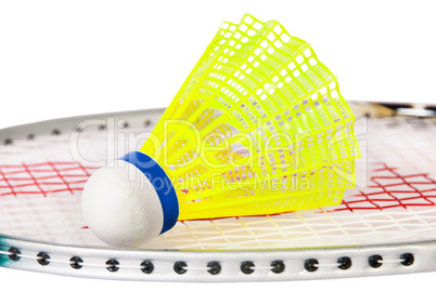 Shuttlecock lying on the badminton racket