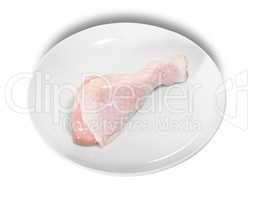 Single Raw Chicken Legs On White Plate