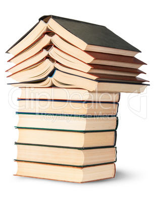 Stack of open and closed old books rotated