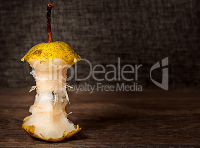 Stub of pear on wooden table