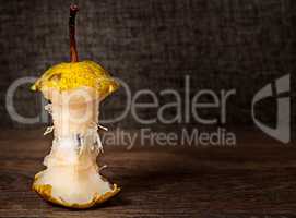 Stub of pear on wooden table