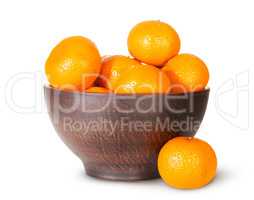 Tangerines In A Ceramic Bowl And One Near