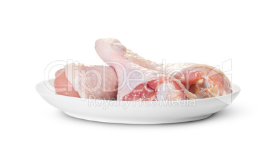 Three Raw Chicken Legs On White Plate Rotated