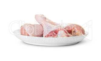 Three Raw Chicken Legs On White Plate Rotated