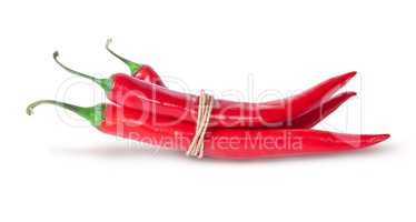 Three red chili peppers tied with a rope