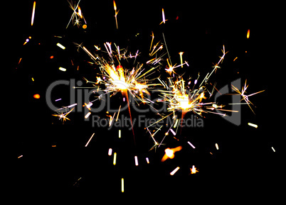 Two bright festive New Year Christmas sparklers