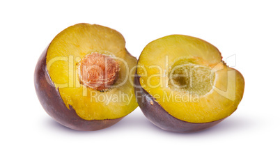Two halves of violet plums near