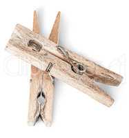 Two old wooden clothespins on each other