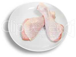 Two Raw Chicken Legs On White Plate