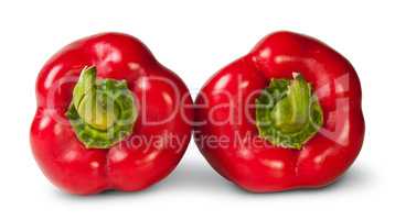 Two Red Bell Peppers Lying Beside