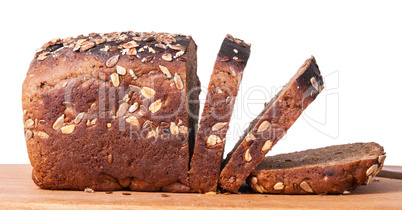 Unleavened bread with seeds sliced on cutting board