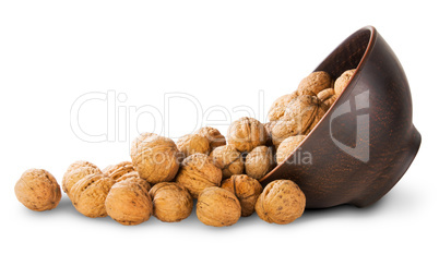 Walnuts Spill Out Of A Clay Bowl