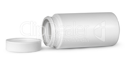 White plastic bottle for vitamins lying near lid