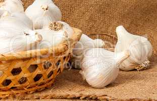Whole head of garlic in a wicker basket