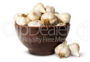 Whole head of garlic in ceramic bowl
