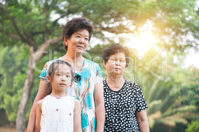 Grandmother and granddaughter outdoor.