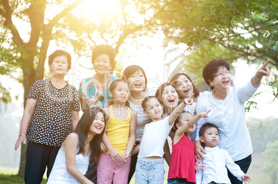 Large group of Asian multi generations family having fun outdoor