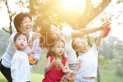 Grandmother, mother and children at outdoors.