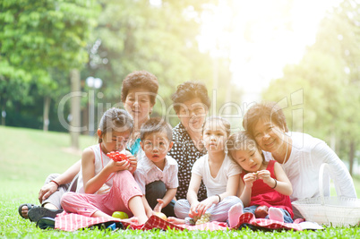 Asian multi generations family at park