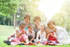 Asian multi generations family at park