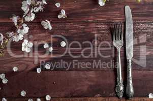 Cutlery knife and fork on a brown table