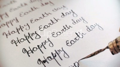 Happy earth day calligraphy and lattering. Ninth line. Close-up whith audio