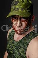 Military Style Camouflage on the Soldier's Face