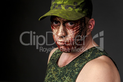 Military Style Camouflage on the Soldier's Face