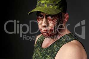 Military Style Camouflage on the Soldier's Face