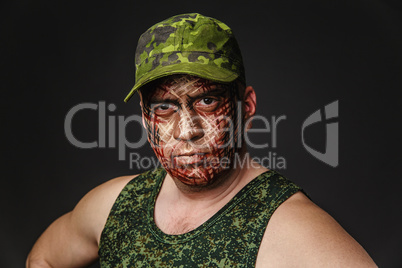 Military Style Camouflage on the Soldier's Face