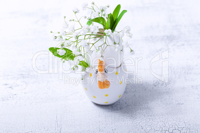 Egg with flowers on a white background. Easter Symbols.