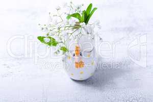 Egg with flowers on a white background. Easter Symbols.