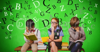 Male and female students studying with letters flying in background