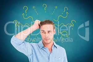 Digital composite image of confused man with arrows and question marks