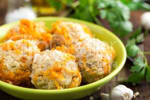 Chicken meatballs with rice braised in vegetables