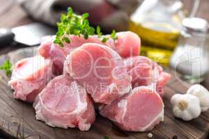 Raw meat, fillet, tenderloin on wooden background