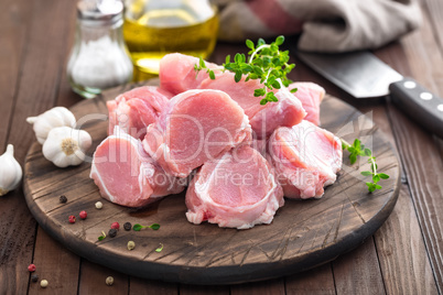 Raw meat, fillet, tenderloin on wooden background