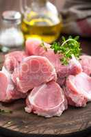 Raw meat, fillet, tenderloin on wooden background