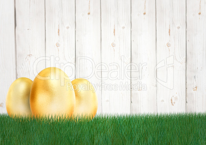 Three gold eggs in the garden. Happy Easter.