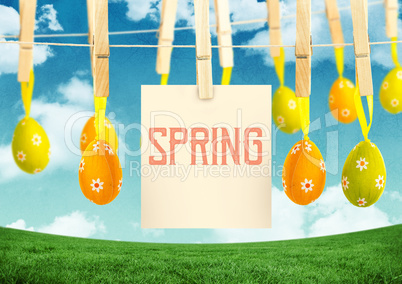 Spring text with Easter Eggs with note on pegs in front of pattern