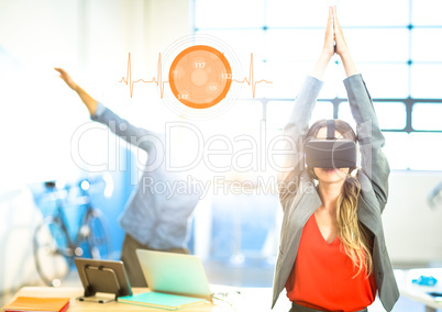 Woman doing yoga exercise wearing VR Virtual Reality Headset with Interface