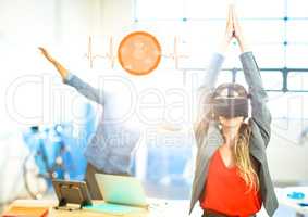 Woman doing yoga exercise wearing VR Virtual Reality Headset with Interface