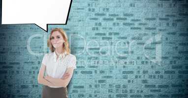 Portrait of confident businesswoman standing arms crossed with speech bubble against brick wall