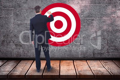 Rear view of businessman standing in front of bull's eye